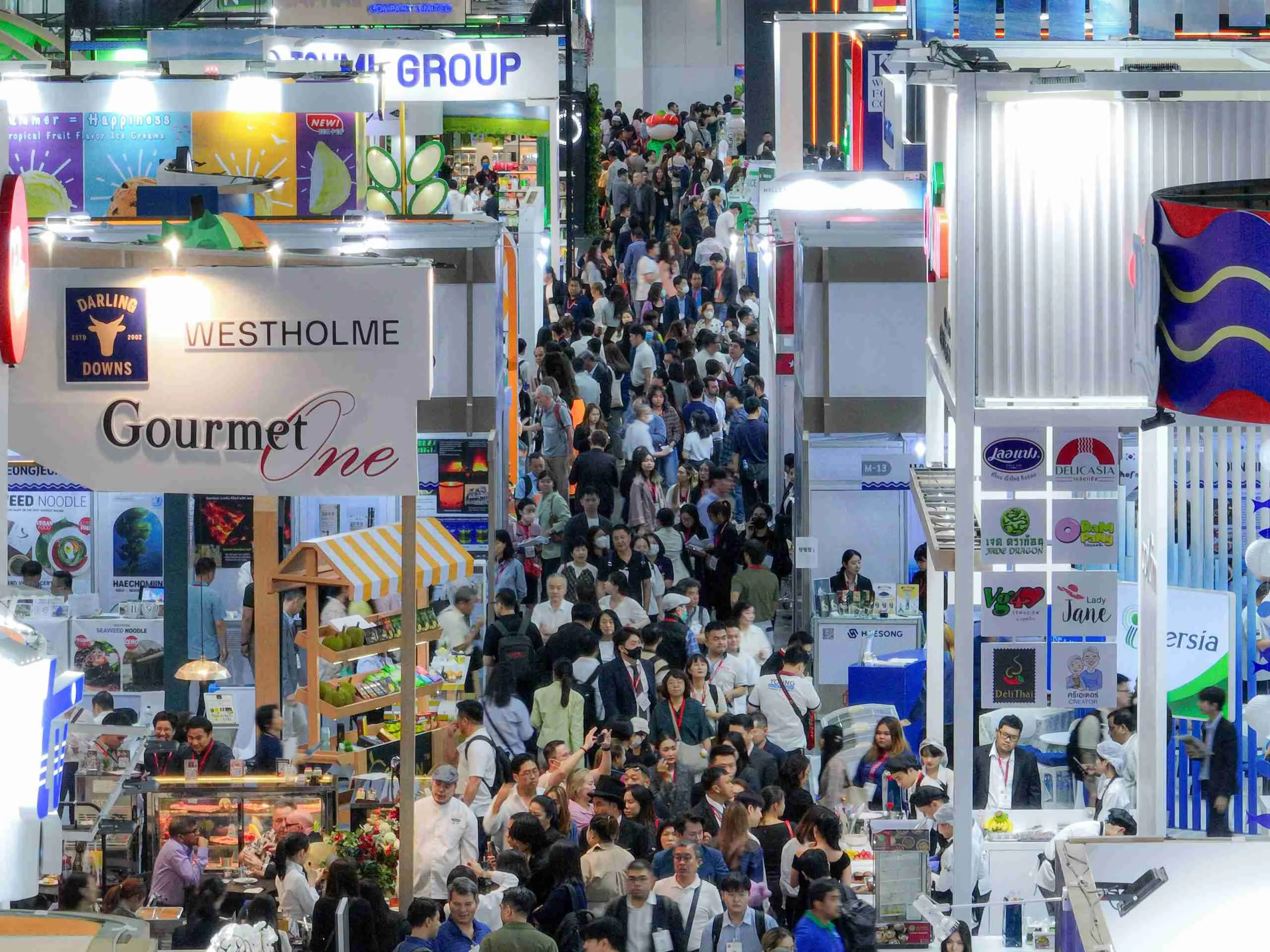 Visitors exploring M-Pacific's featured brands during Thaifex 2025 exhibition.